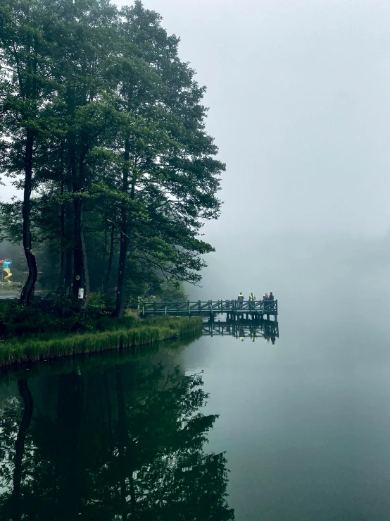 a body of water surrounded by trees on a foggy day, in karuizawa, 8k)), 2022 photograph, phone photo