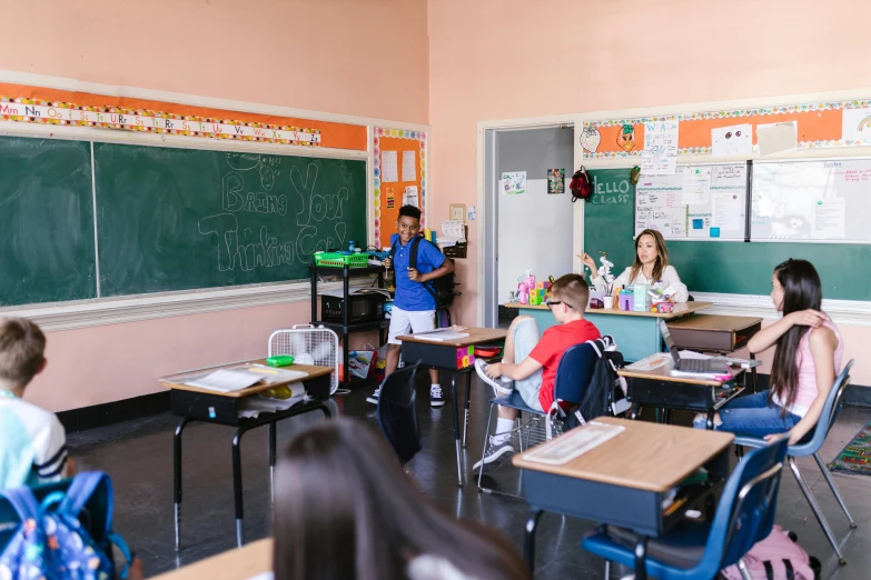 a group of children sitting at desks in a classroom, by Kristian Zahrtmann, pexels contest winner, vancouver school, giving a speech, background image, full body image
