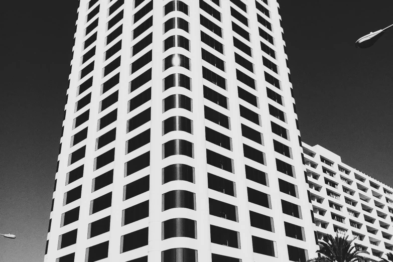 a black and white photo of a tall building, unsplash, instagram story, los angeles 2 0 1 5, highly detailed # no filter, geometric