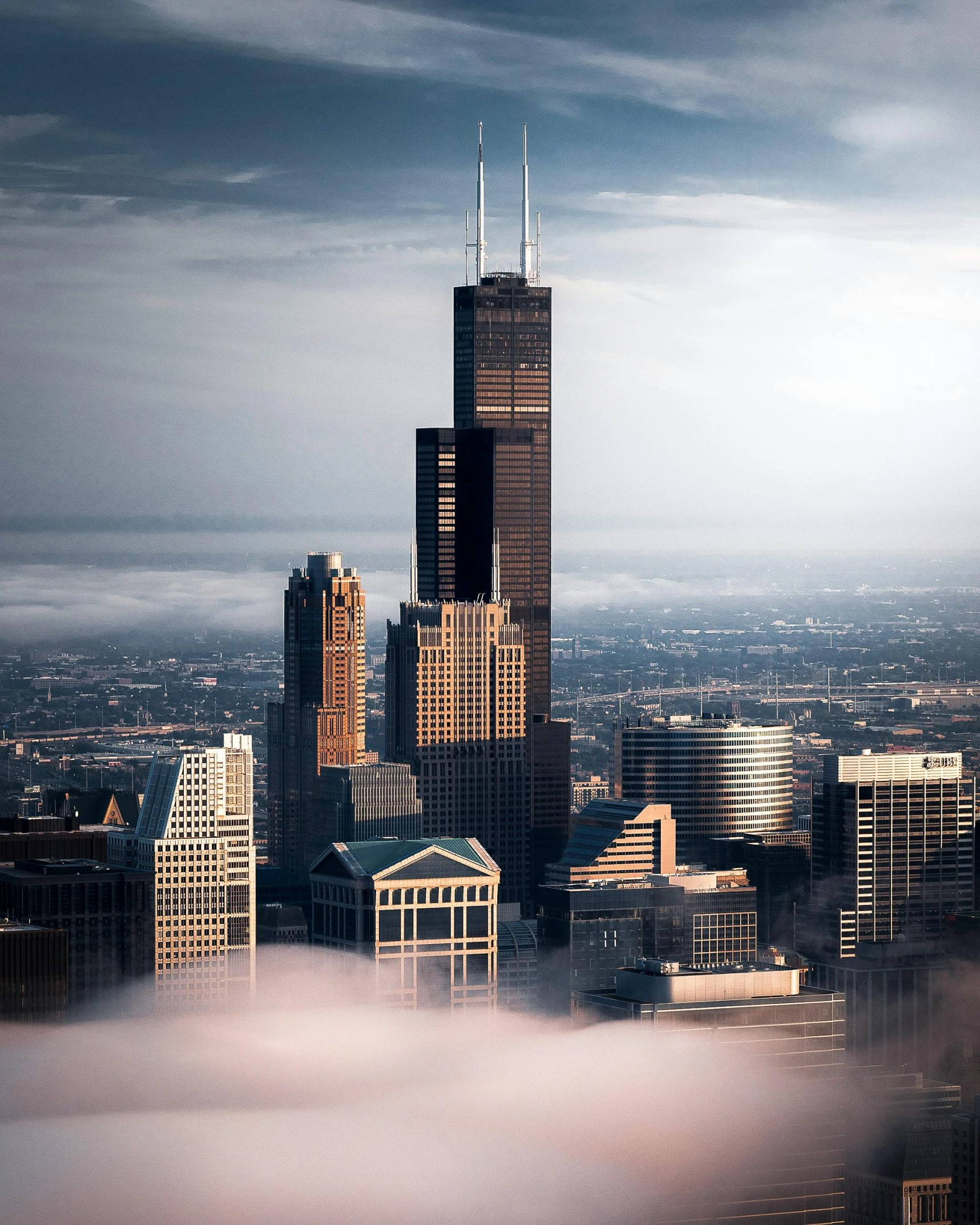 a view of a city from the top of a skyscraper, by Greg Rutkowski, pexels contest winner, romanticism, chicago skyline, castle made of clouds, lgbt, photo for a magazine