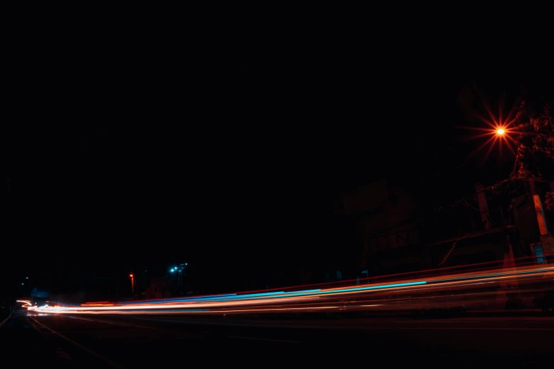 a blurry photo of a street at night, a picture, unsplash, minimalism, motion photo, long exposure photo, night time footage
