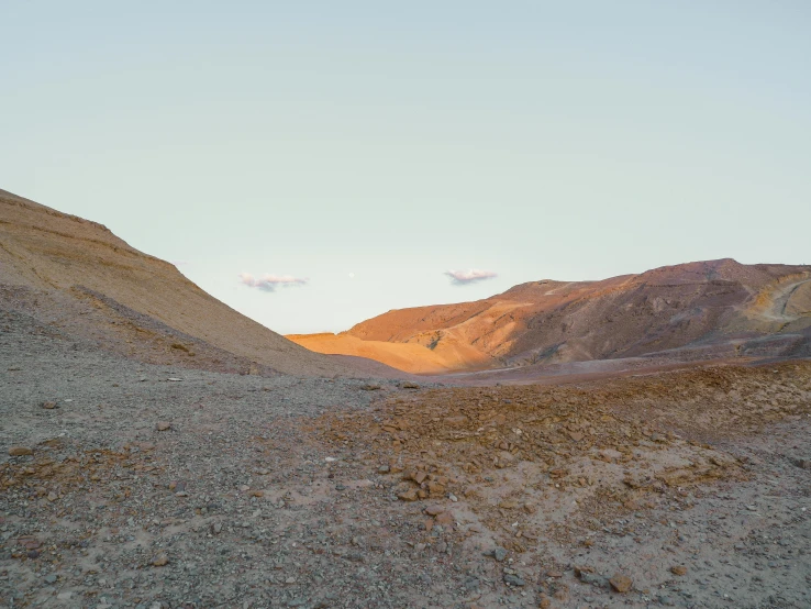 a dirt field with mountains in the background, an album cover, inspired by Filip Hodas, les nabis, death valley, archival pigment print, (golden hour), ochre