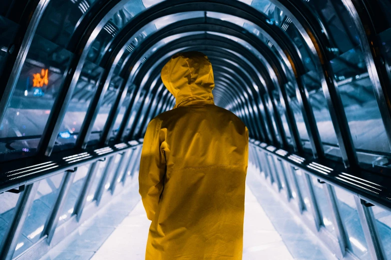 a person in a yellow coat on an escalator, inspired by Beeple, unsplash contest winner, hyperrealism, stood in a tunnel, stood in a lab, yellow raincoat, standing in a maelstrom