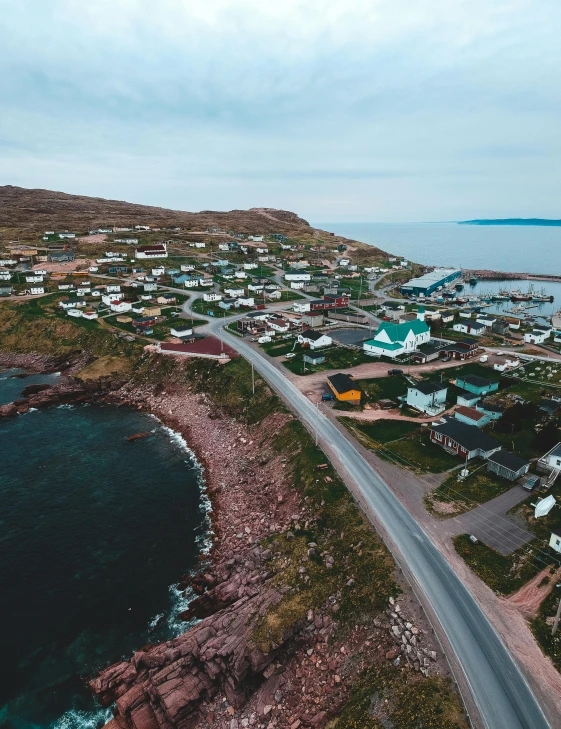 an aerial view of a small town next to the ocean, hziulquoigmnzhah, listing image, photo for magazine, sarenrae