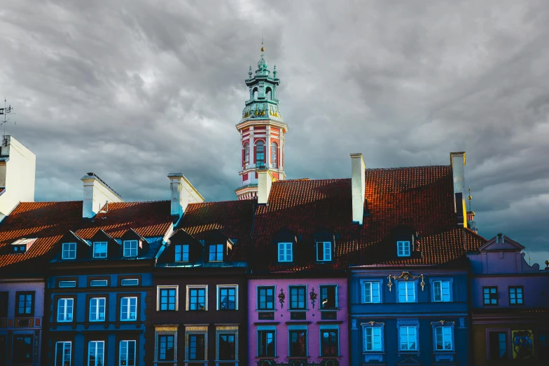 a group of buildings with a clock tower in the background, by Adam Marczyński, pexels contest winner, baroque, strong colours, square, high resolution image, slide show
