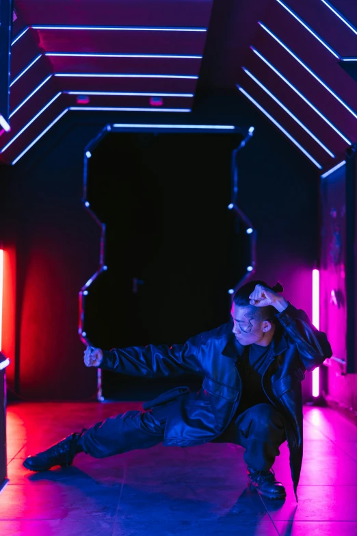 a man standing on one leg in a room with neon lights, an album cover, pexels contest winner, interactive art, ariana grande as a sith, futuristic room, badass pose, cyber future jacket