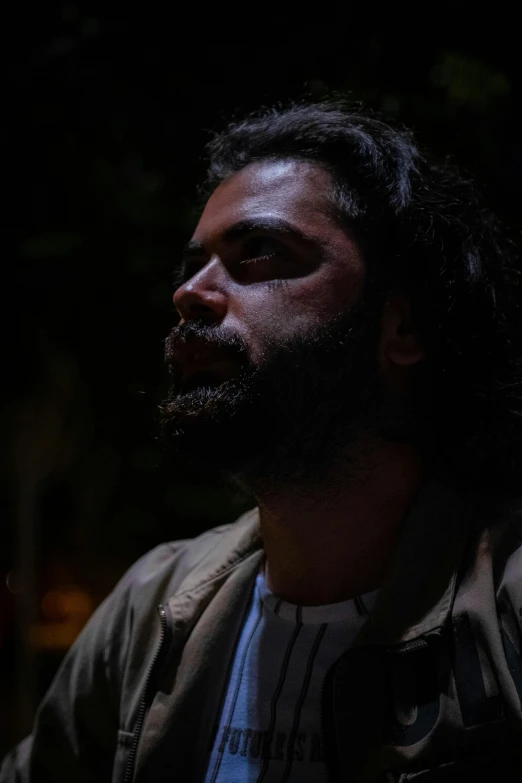 a man smoking a cigarette in the dark, by Youssef Howayek, jason momoa as assyrian, still from a music video, aboriginal australian hipster, slide show