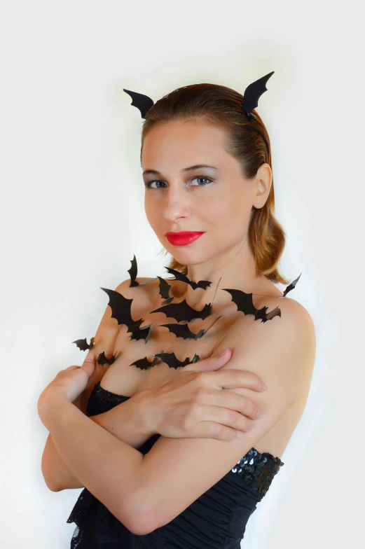 a woman in a black dress with bats on her shoulders, uploaded, modelling, premium, actias luna