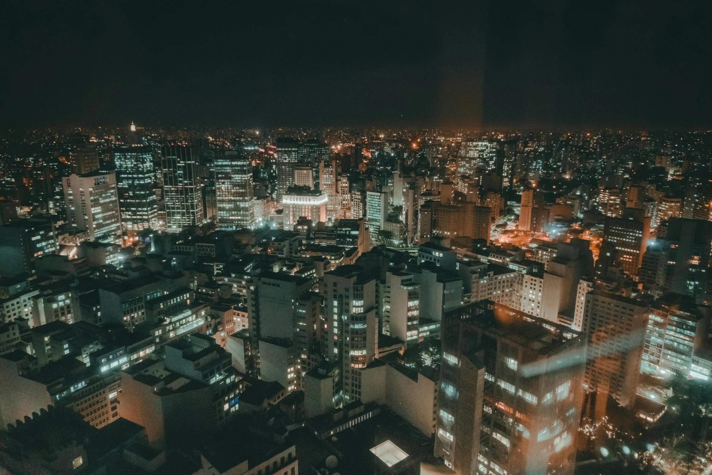 an aerial view of a city at night, pexels contest winner, são paulo, background image, rooftop party, arasaka