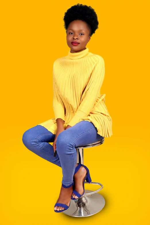 a woman sitting on top of a stool, by Ingrida Kadaka, trending on pexels, in blue and yellow clothes, casual pose, 15081959 21121991 01012000 4k, aida muluneh