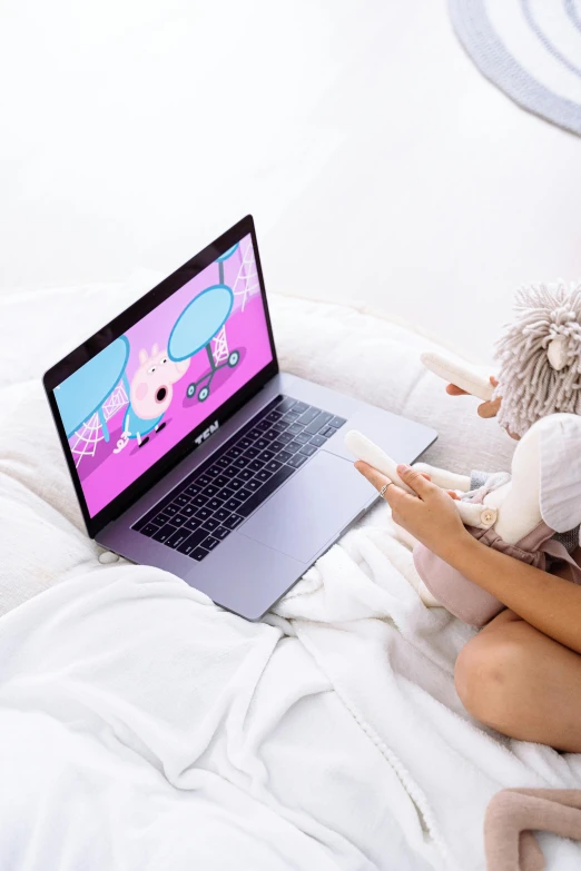 a woman laying in bed with a laptop on her lap, a cartoon, by Julia Pishtar, pexels, 3d littlest pet shop, large screen, inside a child's bedroom, casual playrix games