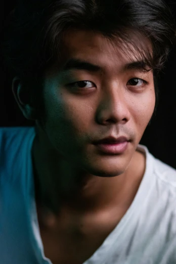 a close up of a person wearing a white shirt, a character portrait, inspired by Joong Keun Lee, pexels contest winner, shot at night with studio lights, lovingly looking at camera, aged 2 5, jin shan and ross tran