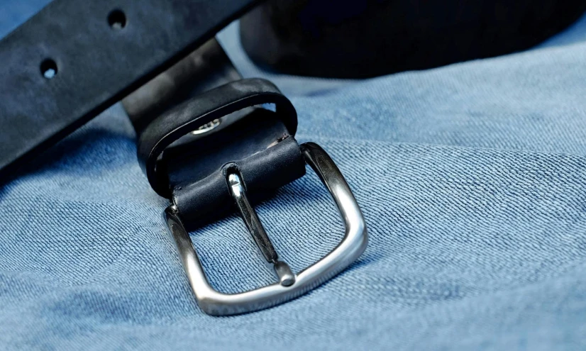 a close up of a belt on a blue shirt, instagram, in gunmetal grey, blue jeans, viewed from bellow