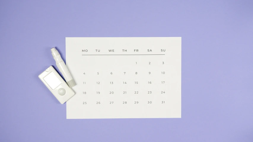 a calendar with a pen sitting on top of it, by Andrei Kolkoutine, trending on unsplash, pastel purple background, ffffound, pregnancy, simple figures