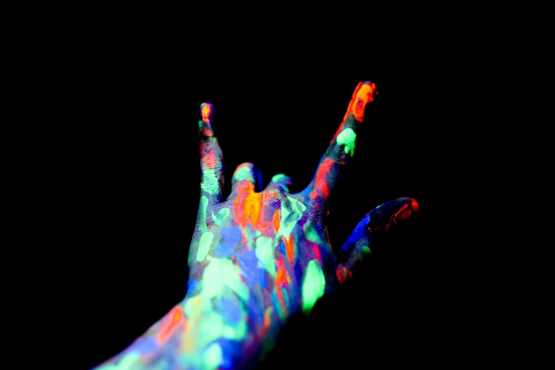a close up of a person's hand with fluorescent paint on it, by Meredith Dillman, art photography, multi colour, middle finger, bio-luminescence, ilustration