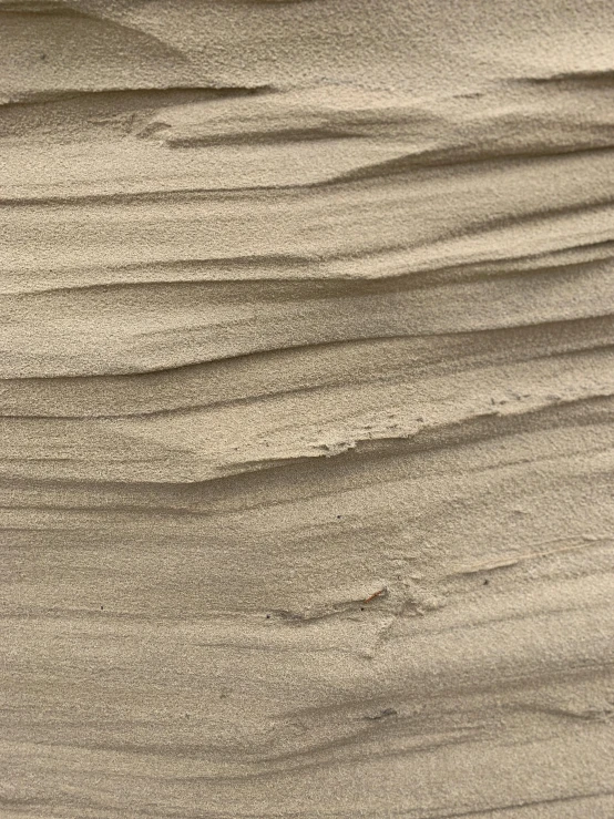 a surfboard sitting on top of a sandy beach, an ultrafine detailed painting, inspired by Kay Sage, tonalism, detail texture, taupe, chiseled formations, 3dcoat h 648