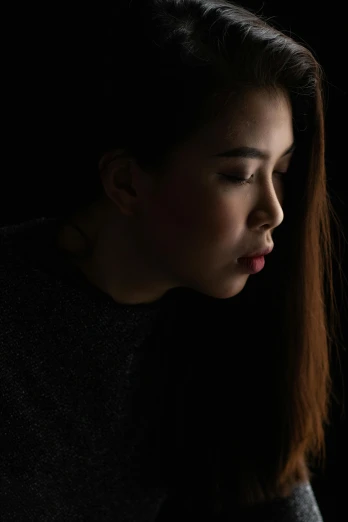 a woman looking at her cell phone in the dark, by Robbie Trevino, detailed face of a asian girl, dramatic lowkey studio lighting, headshot profile picture, neck zoomed in from lips down