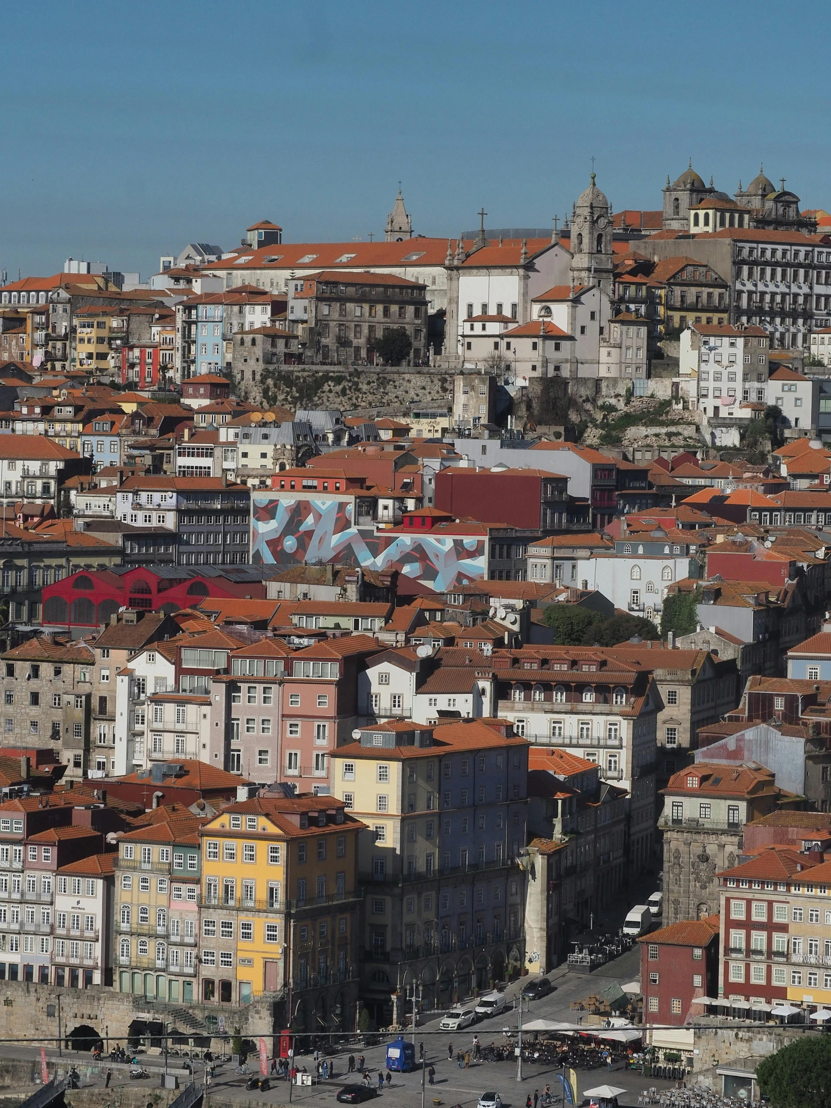 a view of a city from the top of a hill, by Tom Wänerstrand, pexels contest winner, graffiti, azulejo, herzog de meuron, slide show, profile image