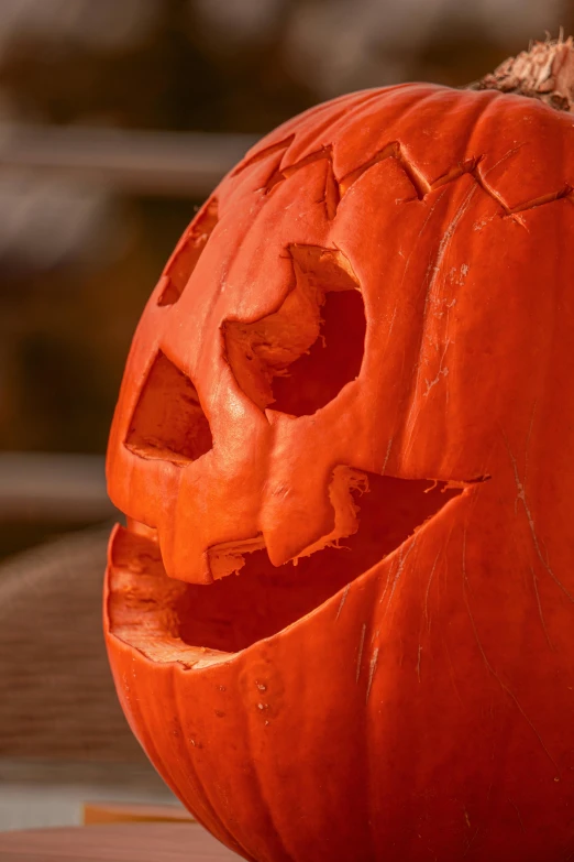 a carved pumpkin sitting on top of a table, profile image