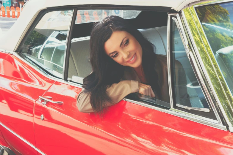 a woman leaning out the window of a red car, arabesque, classic car magazine, square, avatar image, “megan fox