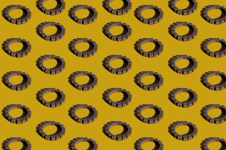 a bunch of rings on a yellow background, inspired by Esaias Boursse, yellow charcoal, perfectly tileable, chewing tobacco, stereogram