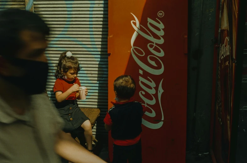 a couple of kids standing in front of a coca cola machine, a picture, by Elsa Bleda, pexels contest winner, graffiti, people watching around, ad image