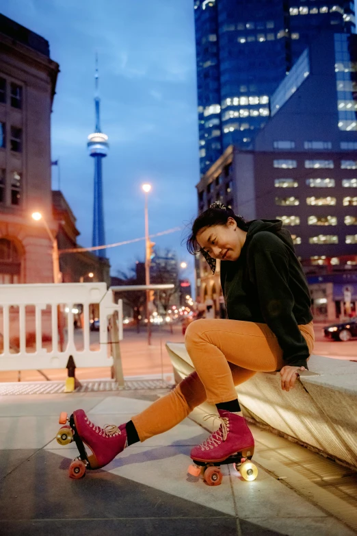 a woman sitting on a ledge on a skateboard, trending on pexels, happening, cn tower, nightlife, pokimane, ashteroth