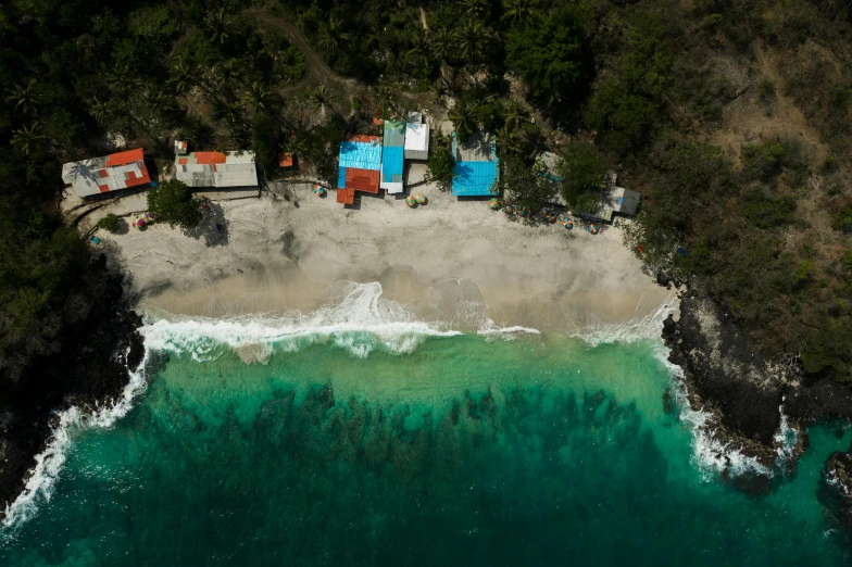 an aerial view of a beach and houses, pexels contest winner, photorealism, mexico, jamaican colors, cliffside, light and dark