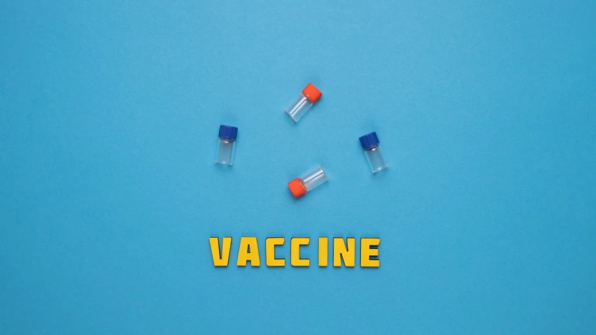 a group of vials sitting on top of a blue surface, an album cover, by Sebastian Vrancx, pexels contest winner, legos, syringe, name is tripmachine, virus