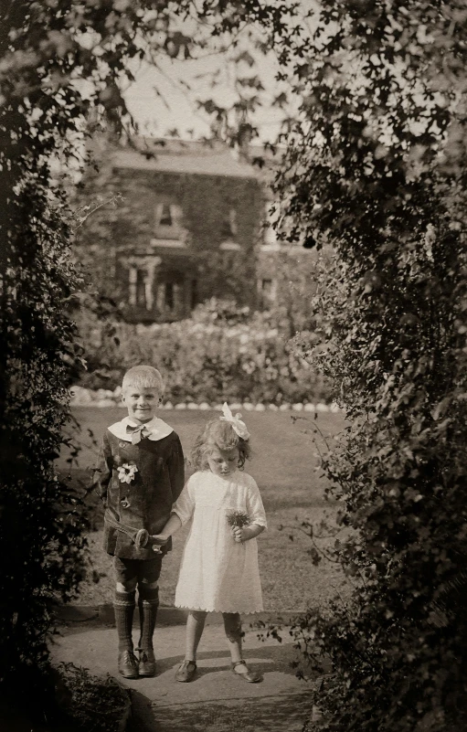a black and white photo of two children, inspired by Kate Greenaway, formal gardens, 4 k photo autochrome, wedding photo, 256435456k film