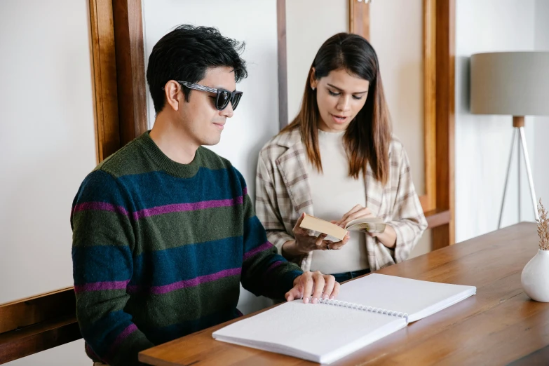 a couple of people that are sitting at a table, trending on pexels, academic art, with sunglass, standing in class, japanese collection product, holding notebook
