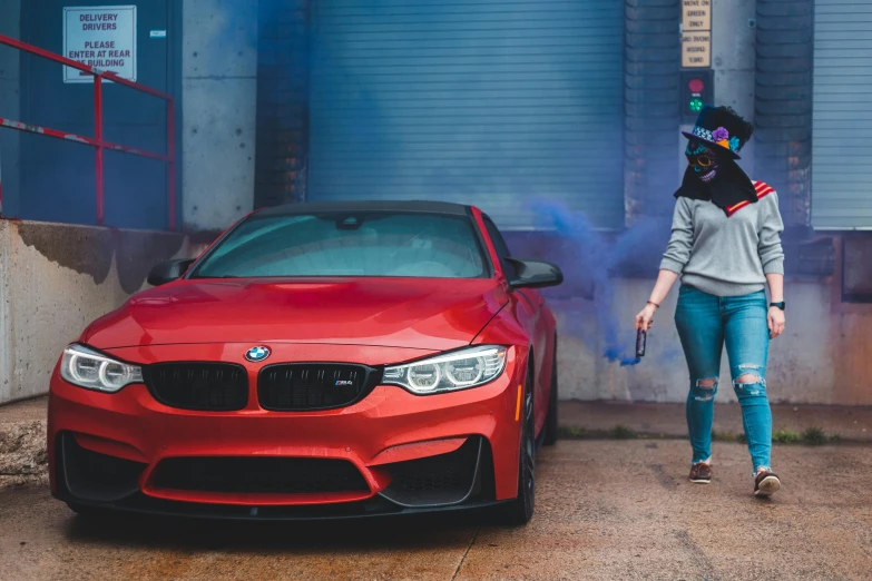 a woman standing next to a red bmw car, pexels contest winner, auto-destructive art, smoke grenade, 🦩🪐🐞👩🏻🦳, red blue purple black fade, with a white muzzle