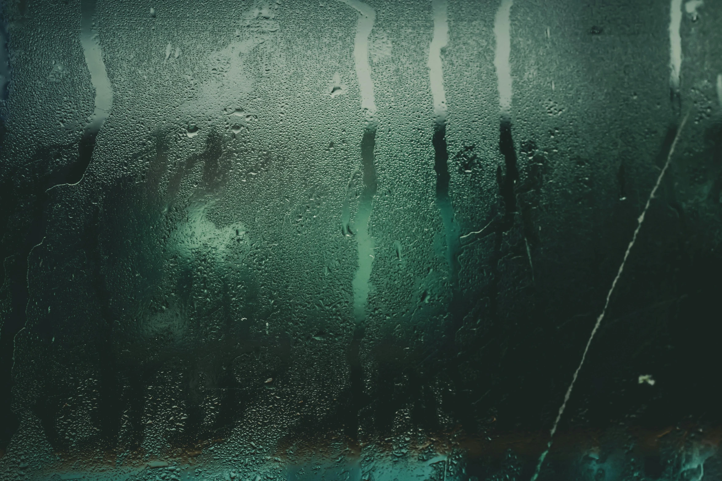 a close up of a window with rain on it, an album cover, inspired by Elsa Bleda, tonalism, ((greenish blue tones)), abstract horror, iphone wallpaper, a cold