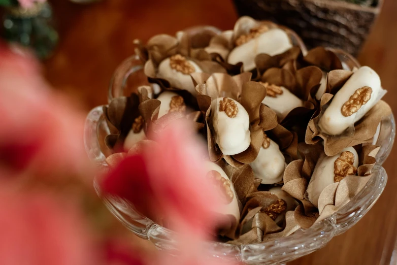 a close up of a bowl of food on a table, brown flowers, magnolia goliath head ornaments, thumbnail, shrooms