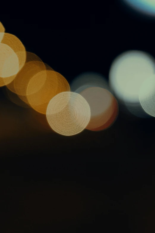 a blurry photo of a city street at night, pexels, pointillism, circles, low detail, hazy, single light