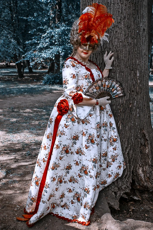 a woman in a red and white dress standing next to a tree, inspired by Karl Bryullov, pixabay contest winner, rococo, costume with blue accents, slide show, photo taken in 2 0 2 0, floral clothes