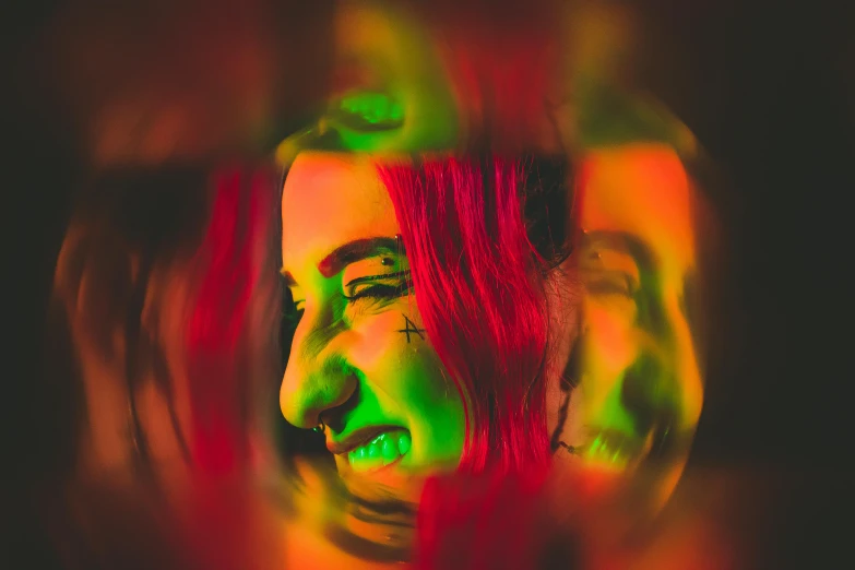 a close up of a person with red hair, pexels contest winner, holography, wicked smile, fluorescent colours, distorted, still photograph