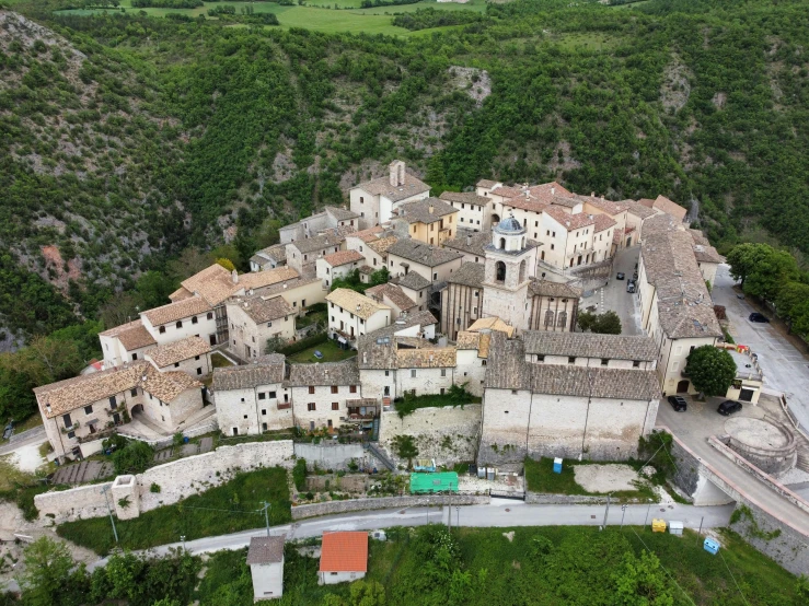 an aerial view of a village in the mountains, a portrait, by Carlo Martini, pexels, renaissance, square, white, conversano, bl