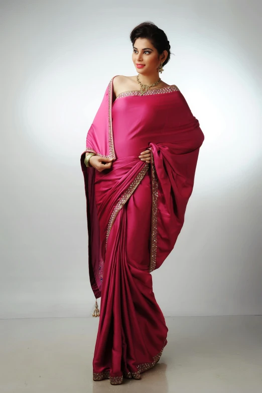 a woman in a pink sari, inspired by Nadim Karam, baroque, sleek curves, deep colours. ”, wearing toga, display”