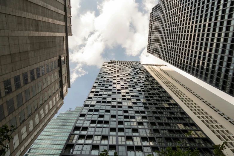 a couple of tall buildings next to each other, pexels contest winner, modernism, various angles, toronto, ignant, high detail photograph