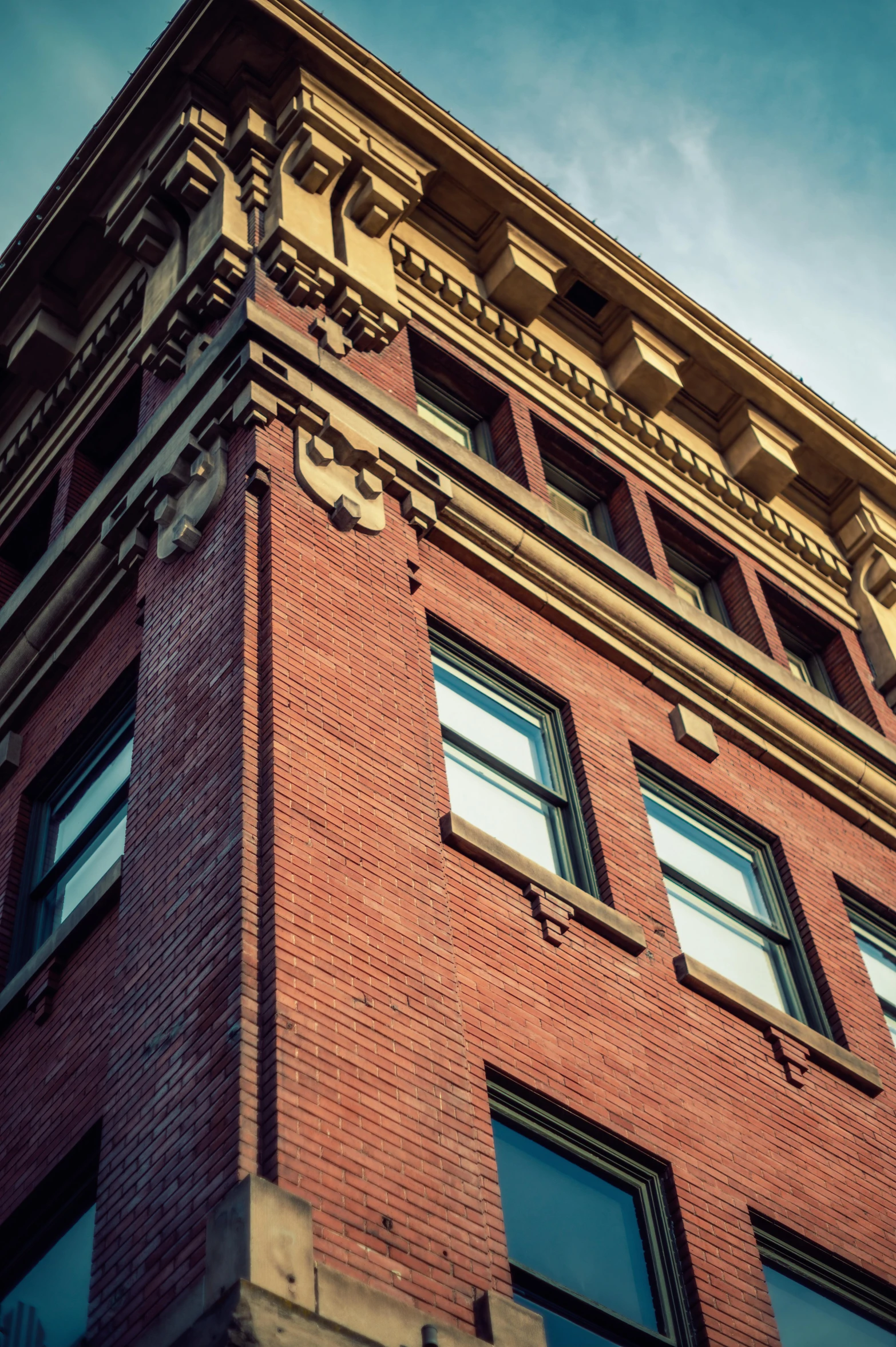 a tall brick building with a clock on the top, by Jason Felix, unsplash, square, left profile, detailed photograph high quality, brown