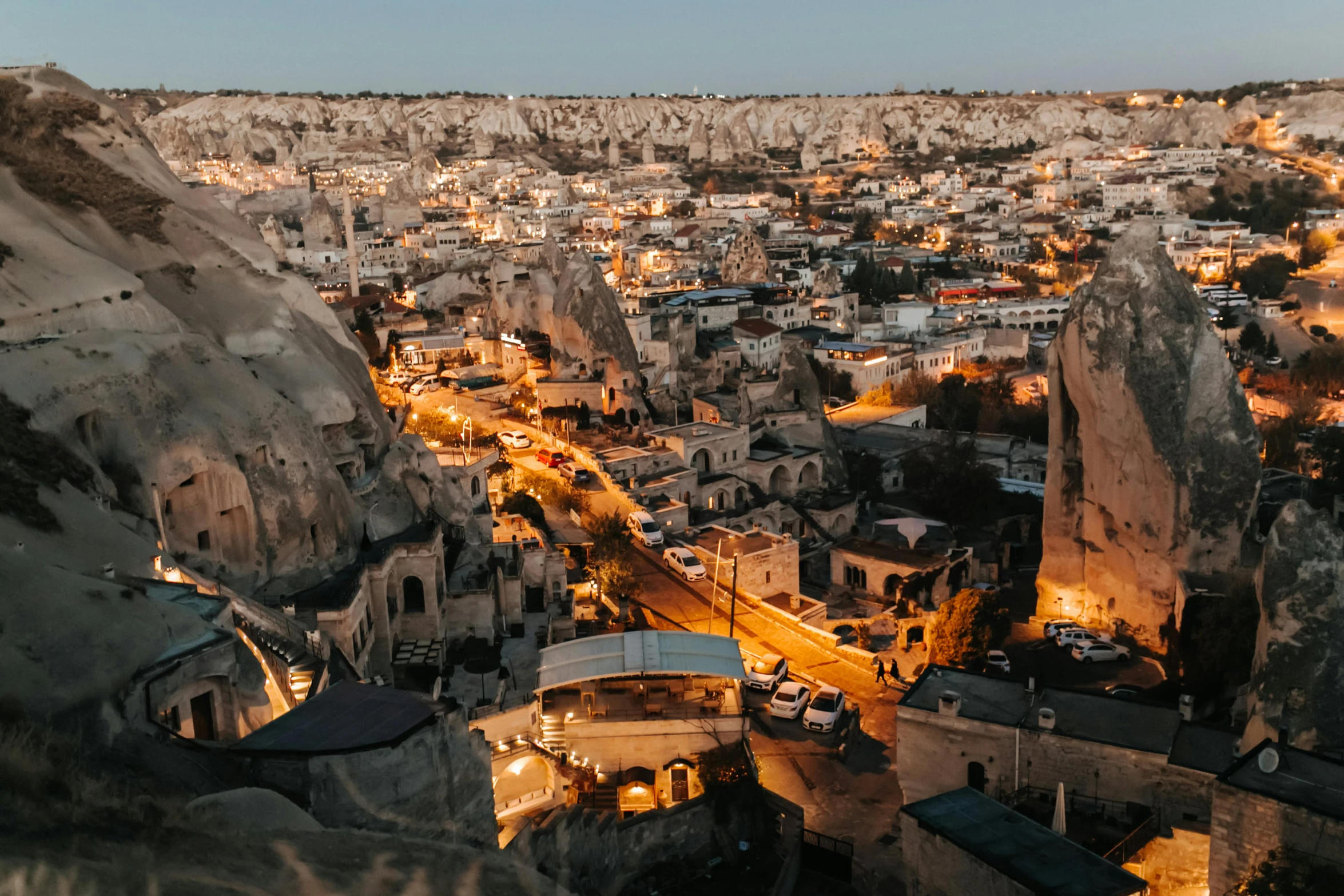 a view of a city from the top of a hill, pexels contest winner, turkey, chiseled formations, warm glow, 2 0 0 0's photo