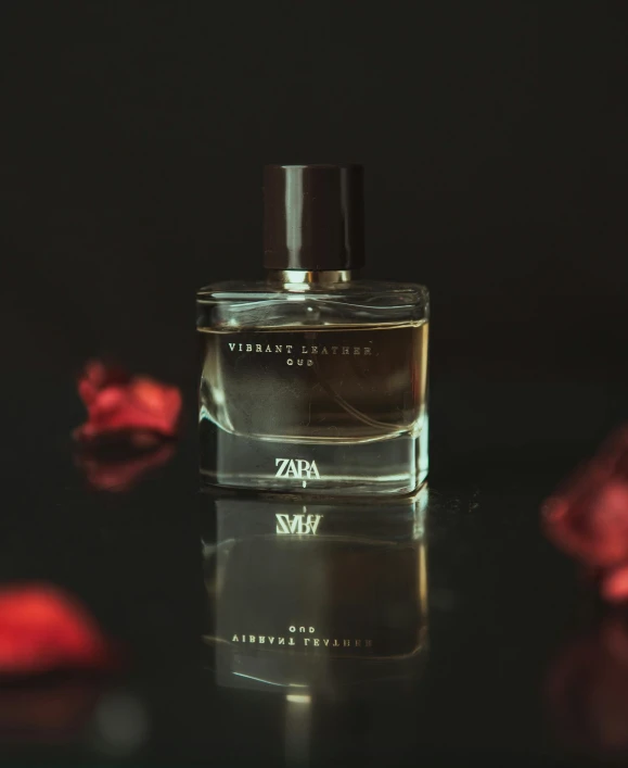 a bottle of perfume sitting on top of a table, inspired by Zhu Da, unsplash contest winner, romanticism, zayn malik, square, black roses, high resolution product photo