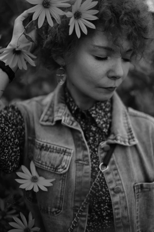 a black and white photo of a woman with flowers in her hair, by Zofia Stryjenska, tumblr, sophia lillis, lofi, low quality photo, cinematic outfit photo