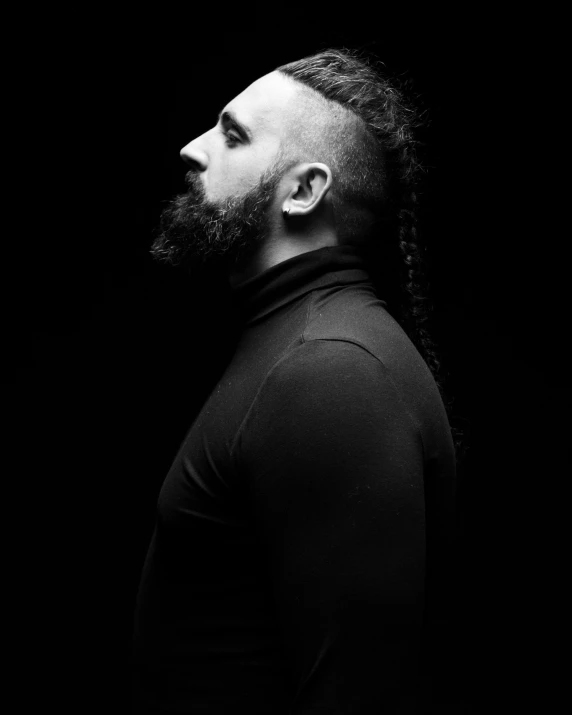 a man with long hair and a beard, a black and white photo, by Adam Marczyński, with a mohawk, gal yosef, profile image, square