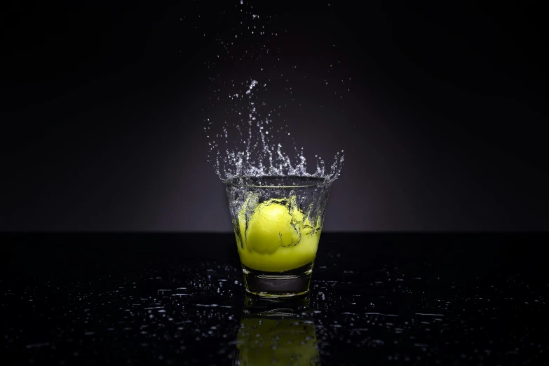 a lemon splashing into a glass of water, a picture, by Matthias Stom, unsplash, renaissance, tennis ball, octane high quality render, uneven glass apple in the dark, high quality product image”
