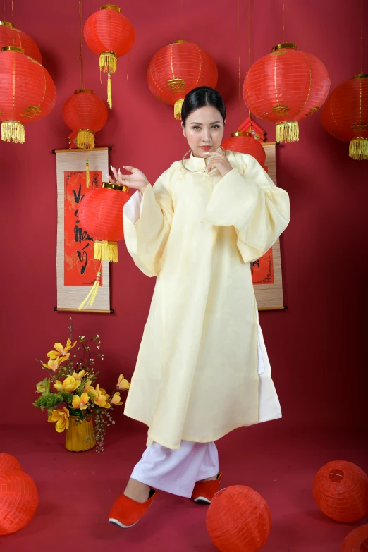 a woman standing in front of a bunch of red lanterns, inspired by Tang Di, wearing wheat yellow gauze, white, promotional photo, white sleeves