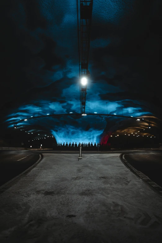 a street at night with a full moon in the sky, a picture, by Sven Nordqvist, unsplash contest winner, light and space, inside futuristic hangar, blue lamps on the ceiling, with dramatic sky, curved perspective
