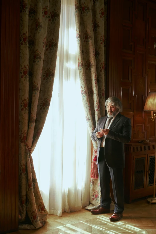 a man in a suit standing in front of a window, by Peter Churcher, baroque, curtains, peter jackson, annie liebowitz, presidential