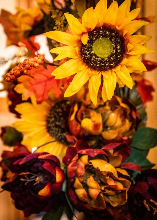 a vase filled with sunflowers and other flowers, fall leaves, close up details, breathtaking quality, walking down